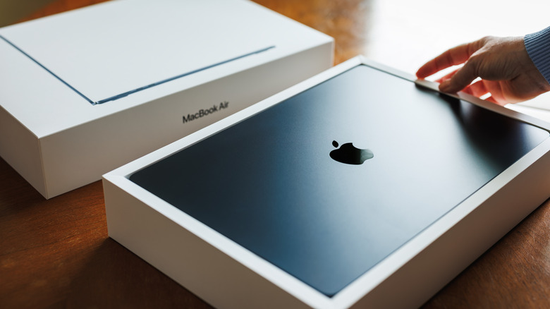Someone unboxing a MacBook Air 15-inch