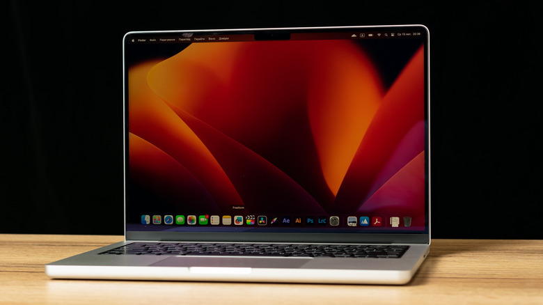 An M3 Pro MacBook sitting on a desk with the desktop shown