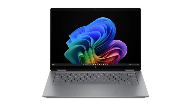 HP OmniBook X, a laptop with a grey body and a black screen frame that has uneven edges at the lower end for easier holding