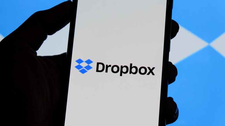 Dropbox logo displayed on a smartphone screen against a blue background