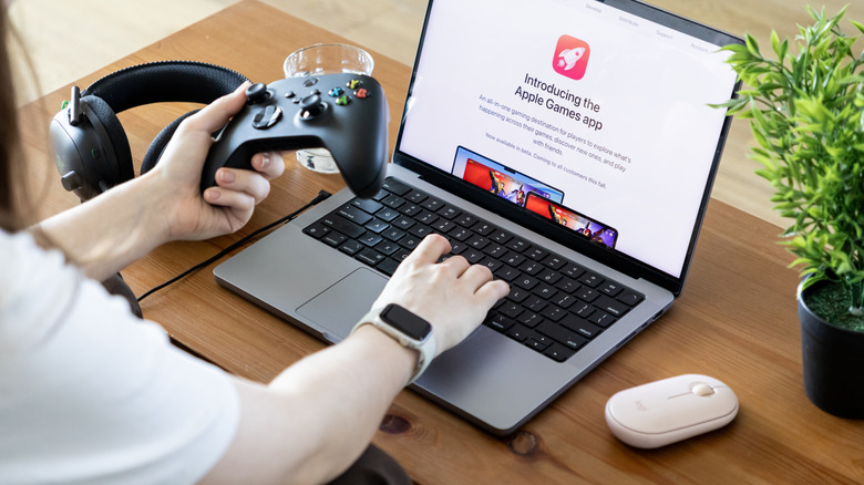 Apple Games app presented on MacBook Pro, used with Xbox controller, Logitech mouse, showing modern gaming experience