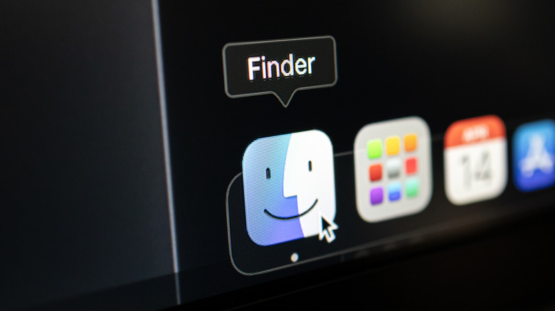 A mouse cursor hovering over the Finder icon on a macOS screen