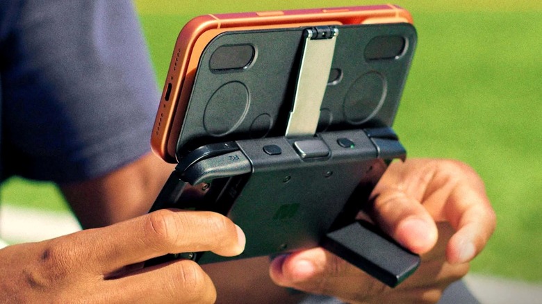 Close-up of a person using the MCON Magnetic Gaming Controller on their iPhone