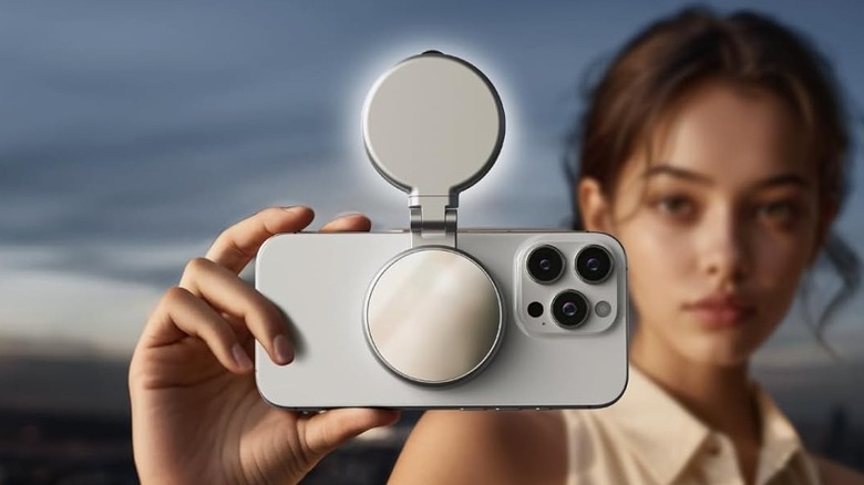Close-up of a person using the Telesin C03 Magnetic Selfie Light to take a photo on their iPhone