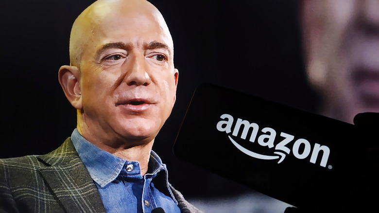 Jeff Bezos on a stage with the Amazon log on the silhouette of a smartphone.