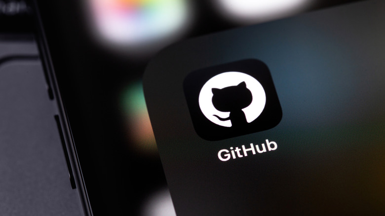 GitHub app icon displayed on a phone