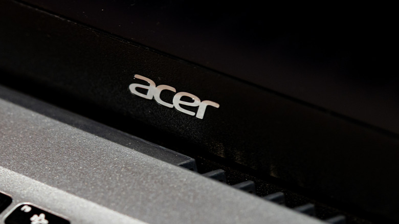 Close-up shot of an Acer logo on a laptop