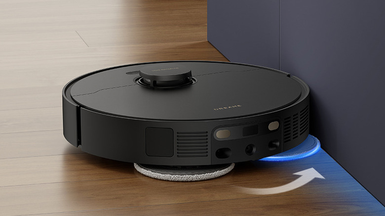 DREAME L40s Ultra Robot Vacuum is pictured on a laminate floor.
