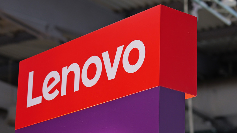 The Lenovo logo displayed on a sign featuring white text and a red background.