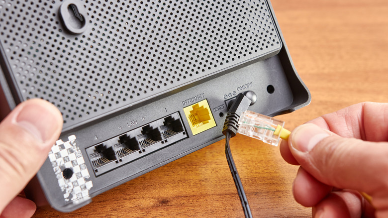 person connecting a router