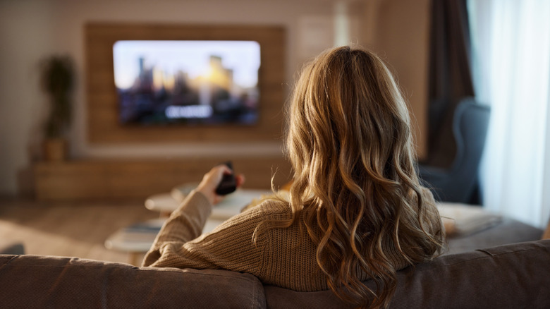 person streaming video on tv