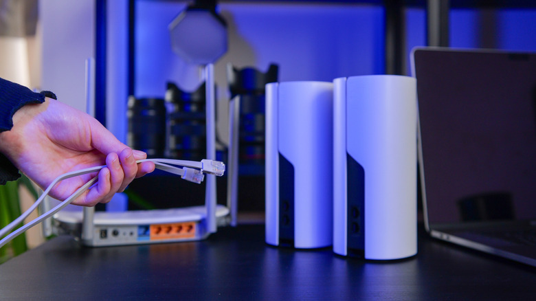 person setting up mesh wifi network