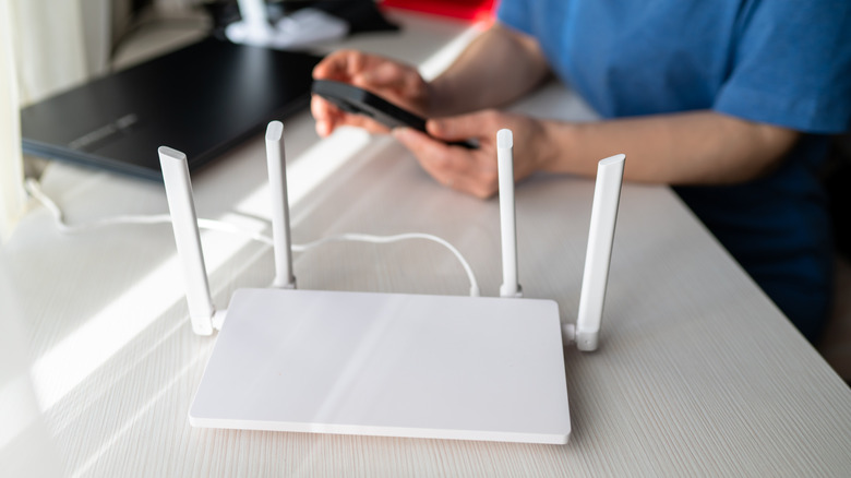 person tweaking router settings