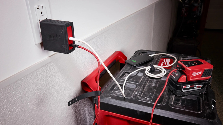 Milwaukee 120 W USB C PD Charger and power adapter plugged in.