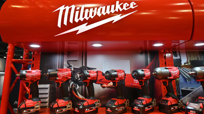 Milwaukee brand name logo displayed above a series of power drills.