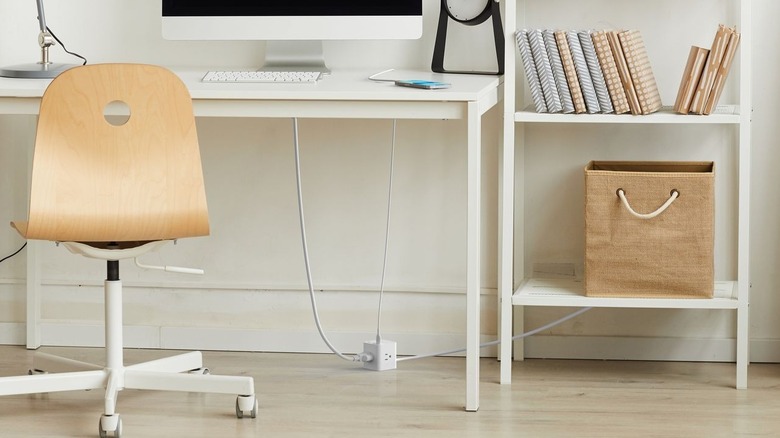 Belkin Power Cube on floor connected to devices on table