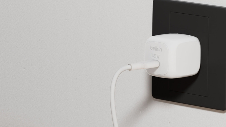 Belkin charger connected to wall outlet with cable