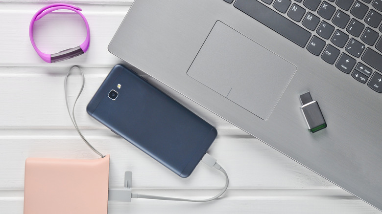 An assortment of gadgets and devices, like a smartphone, laptop, and smartwatch.