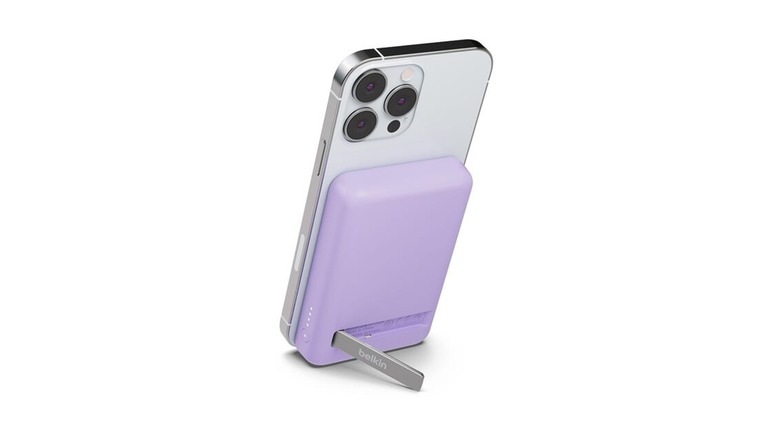 A light purple magnetic phone charger and stand.