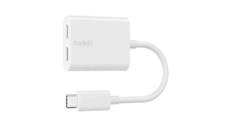 A white USB-C audio and pass-through charging adapter from Belkin.