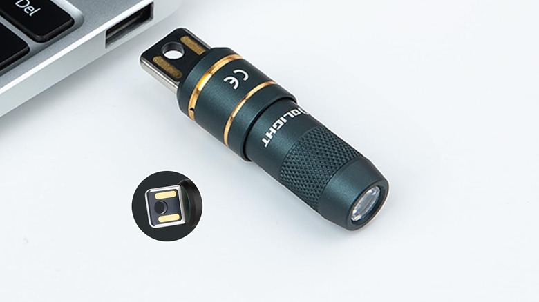 Olight being plugged into a USB Port to be charged