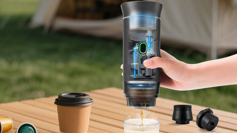 Obecilc Coffee Maker being used to make a shot of coffee, showing off the internals of the device