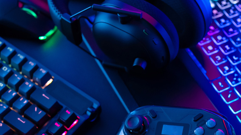 Gaming peripherals lit by RBG on a gaming PC desk