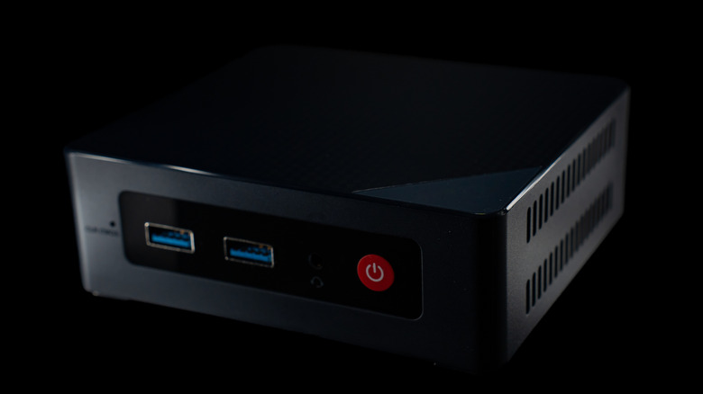 A mini PC against a black background