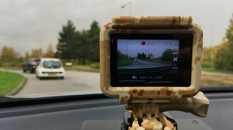 A dash cam recording footage of the road.