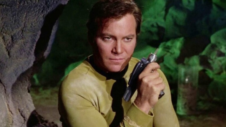 Captain Kirk holding a phaser