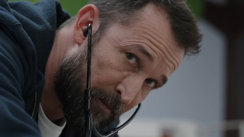 Dr. Michael Robinavitch examining patient during hospital scene in The Pitt (2025)