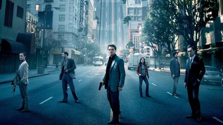 Inception cast standing in the street