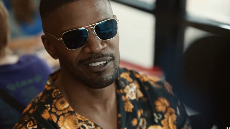 Art wearing shades and smiling