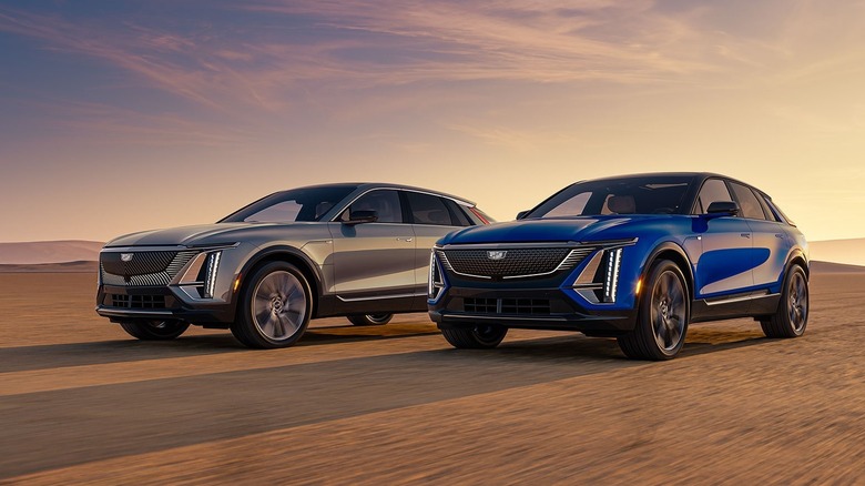 Two 2026 Cadillac Lyriq side by side, one in grey and the other in blue.