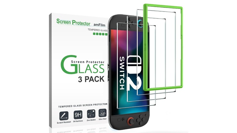 A Nintendo Switch 2 on its side with screen protectors and a box next to it