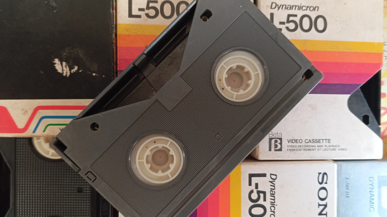 A Betamax cassette on top of several boxes.