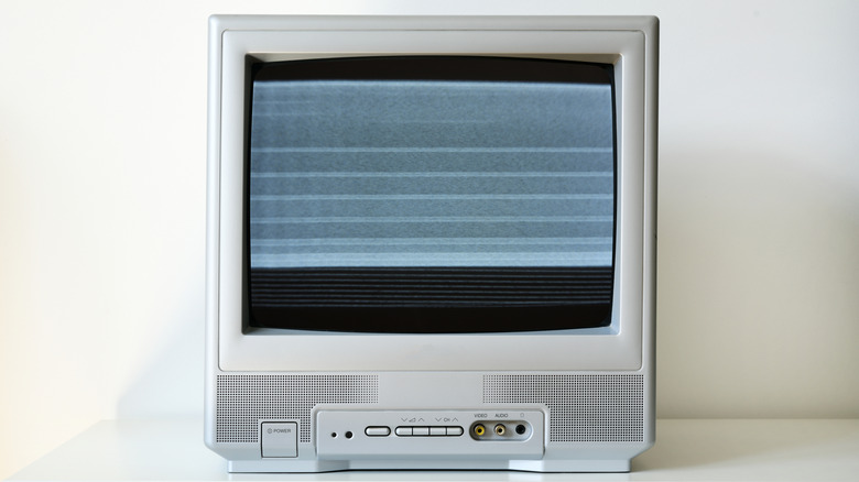 A small CRT TV displaying static.