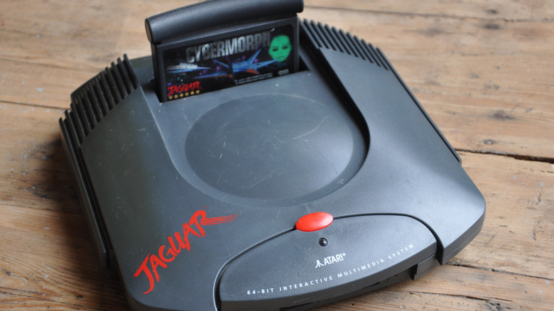 Atari Jaguar console on wooden table with Cybermorph cartridge