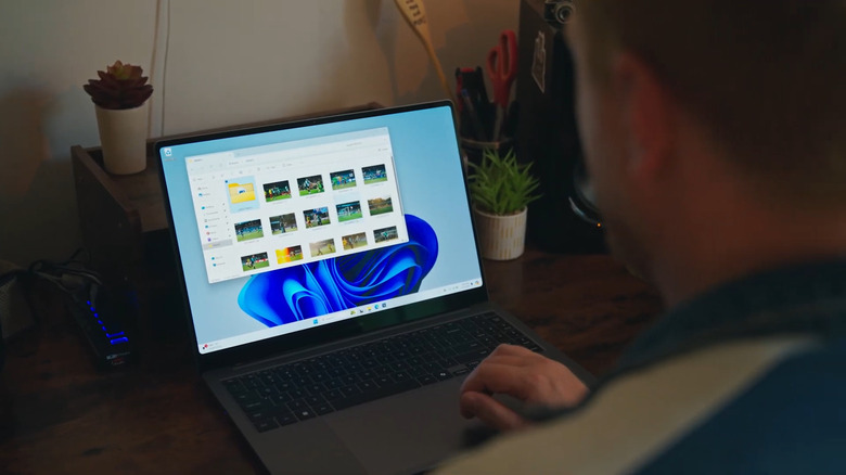 Man using Windows 11 laptop on a desk