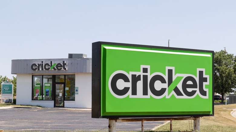 A Cricket Wireless sign in front of a Cricket Wireless retail store.