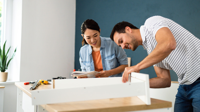 A couple doing a home improvement project together