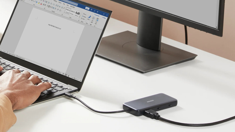 A USB-C hub plugged into a laptop