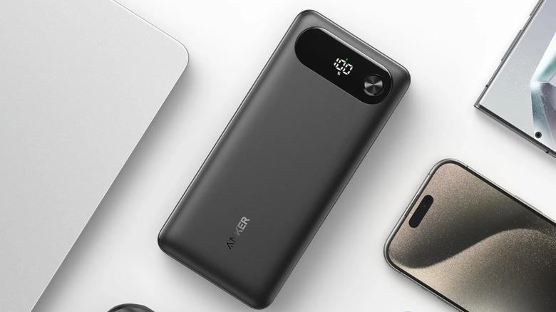 An Anker Power Bank on a white background with various devices around it