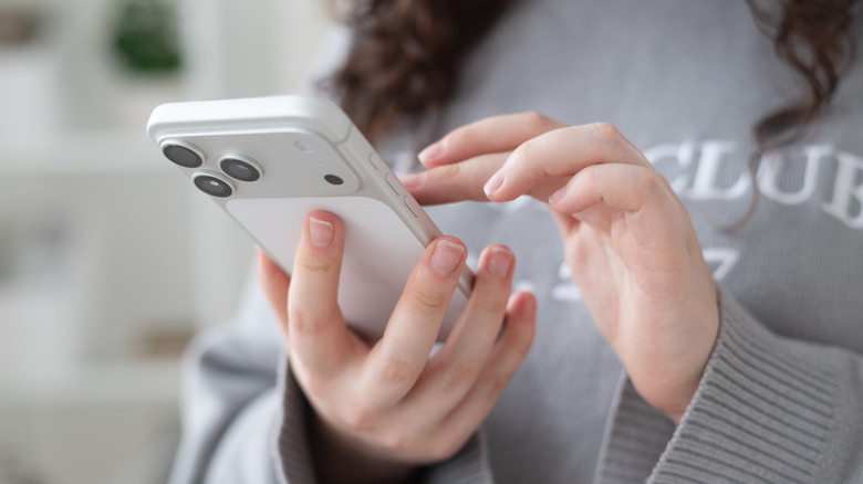 A person using an iPhone 17 Pro Max