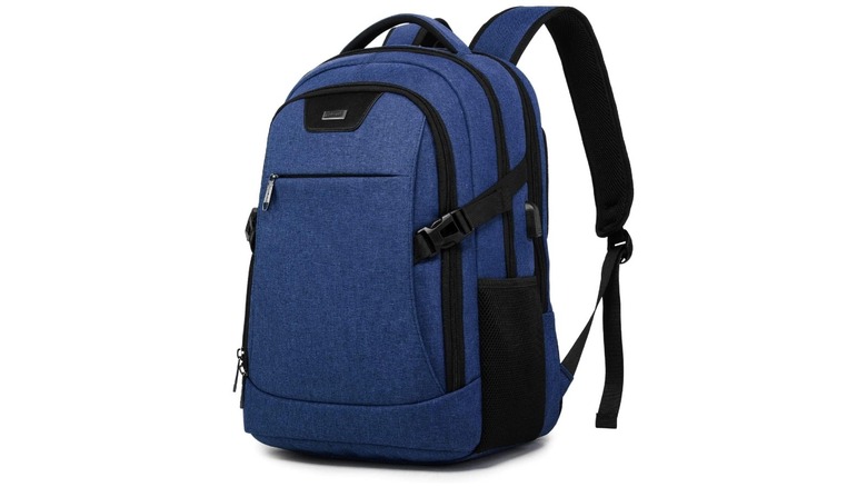 A blue backpack with black zippers and black straps crossing from either side to the font pocket.