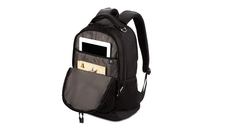 A black backpack with its middle compartment open and a tablet and book stored in separate pockets.