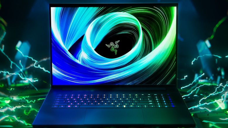 Razer Blade 18 with an 18-inch display showing a vibrant green-blue abstract graphic.