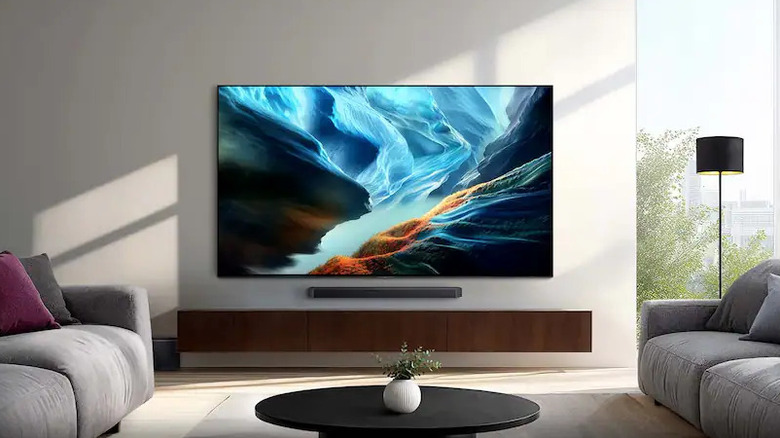The Samsung 83-inch S90H OLED mounted in a modern living room.