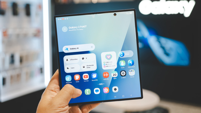A person holding the Samsung Galaxy Z Fold 7 unfolded.