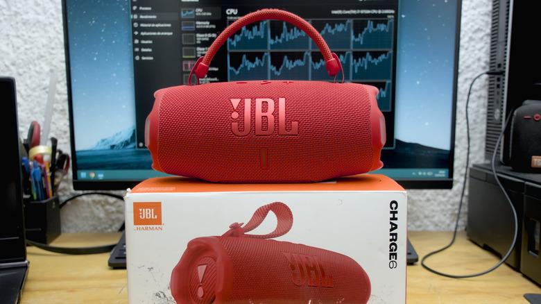 The JBL Charge 6 on top of its box.